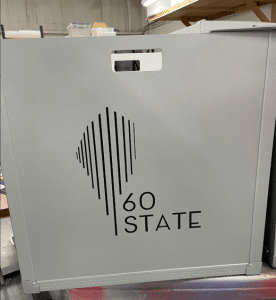 Gray bin branded to location