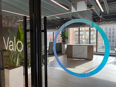 valo-health-reception Reception area through glass entrance